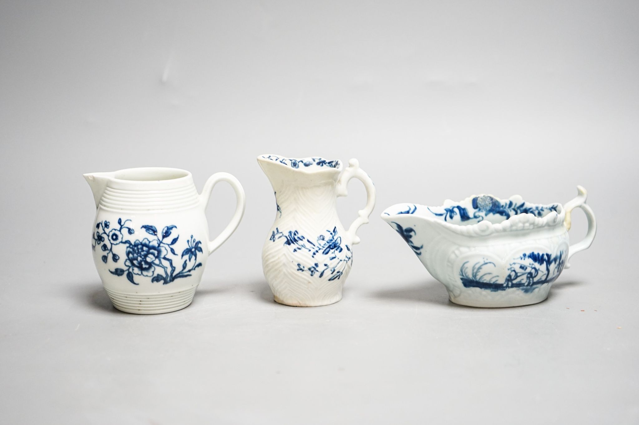 A Worcester blue and white sauceboat, sparrow beak milk jug and a Mansfield pattern milk jug, tallest 9 cm